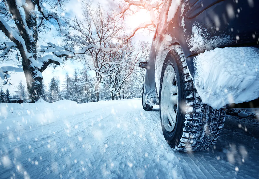 car on winter road low angle view